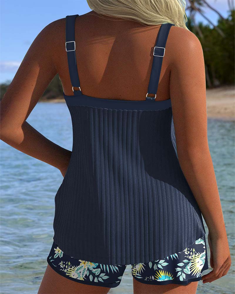 Flattering striped tankini top for women, part of a two-piece swimsuit set with comfortable beach shorts.