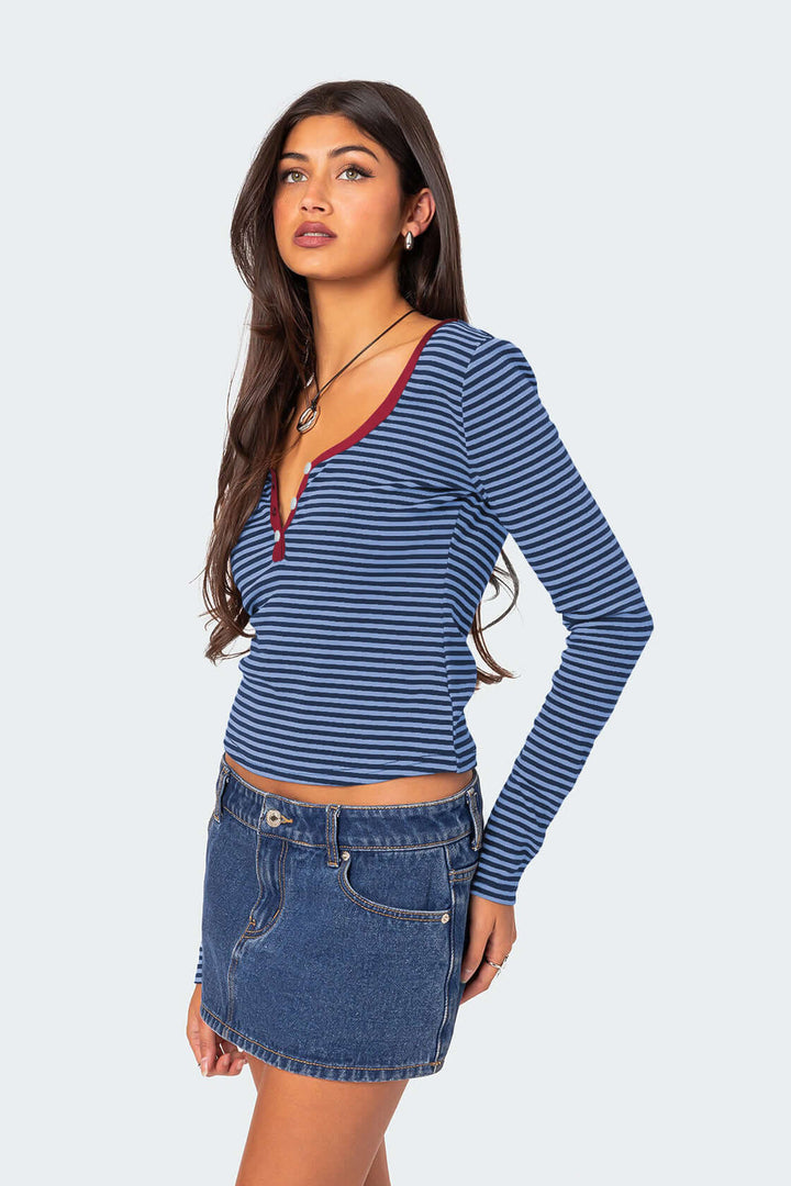 Chic women's striped Henley top with V-neck & long sleeves, great for comfortable casual wear.