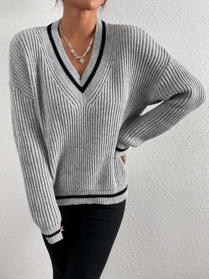 Comfortable women's long sleeve V-neck striped jumper, great for everyday casual wear.
