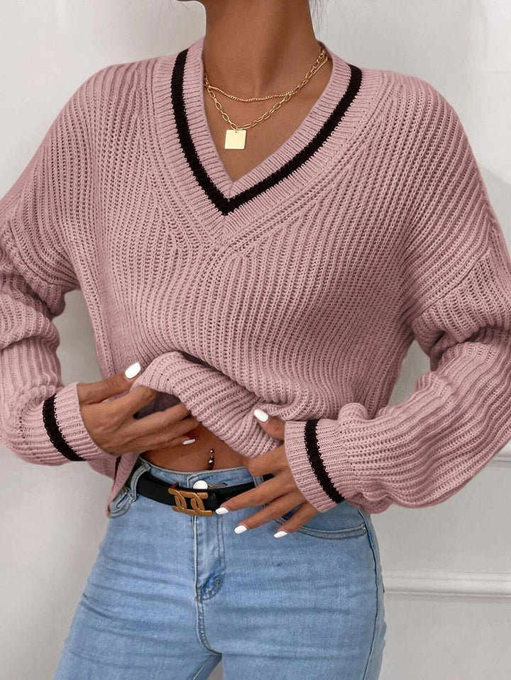 Fashionable women's relaxed fit striped V-neck sweater, a stylish pullover for autumn.