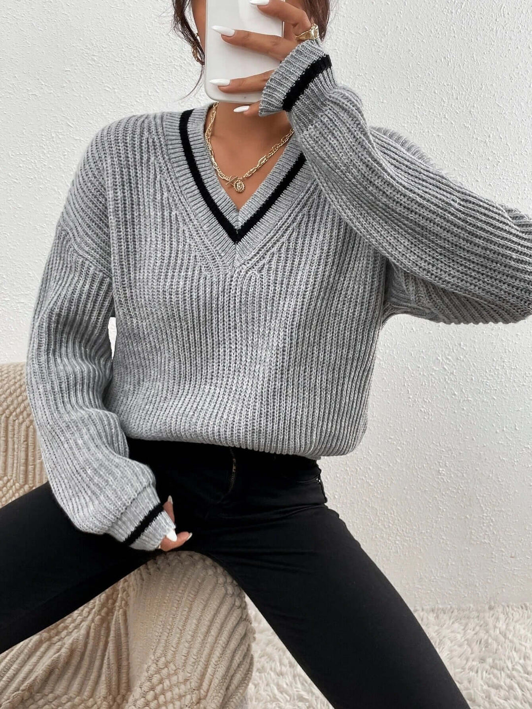 Women's long sleeve striped V-neck sweater, a relaxed fit pullover for effortless style.