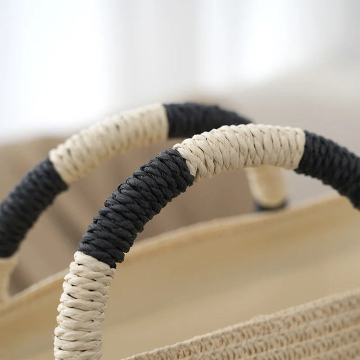 Stylish women's woven tote bag with classic stripes. Perfect everyday shoulder bag for summer fashion.