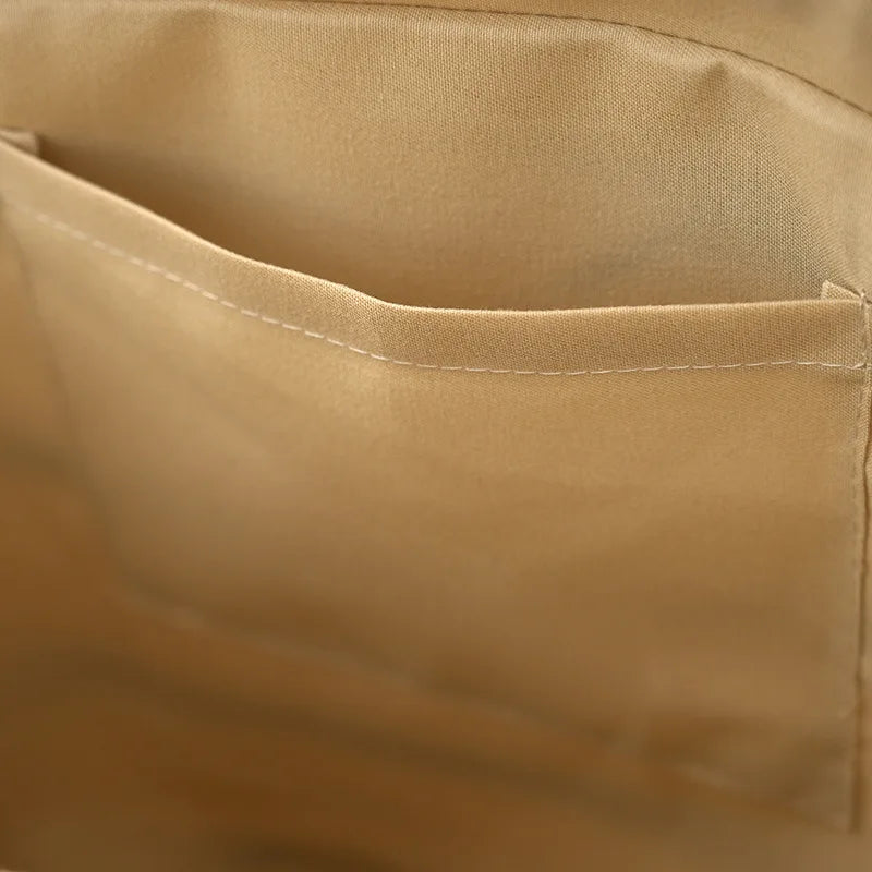 Close-up of women's striped woven tote bag, highlighting natural texture & design. Versatile beach & casual bag.