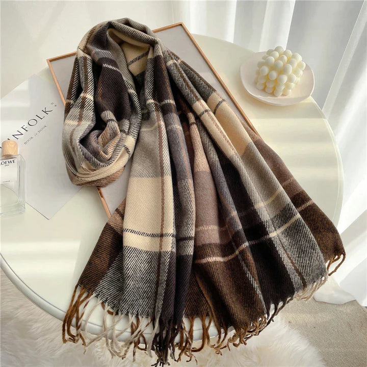 Angela knitted winter scarf for women, featuring a chic checkered pattern and playful tassels.