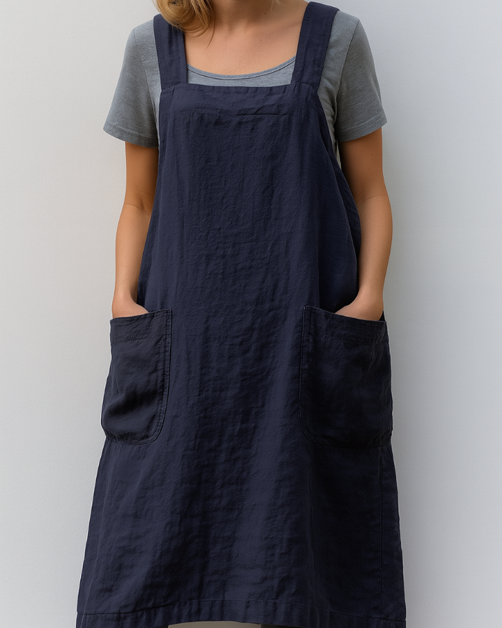 Comfortable women's apron dress, perfect for summer. Features practical pockets and adjustable straps for an easy fit.