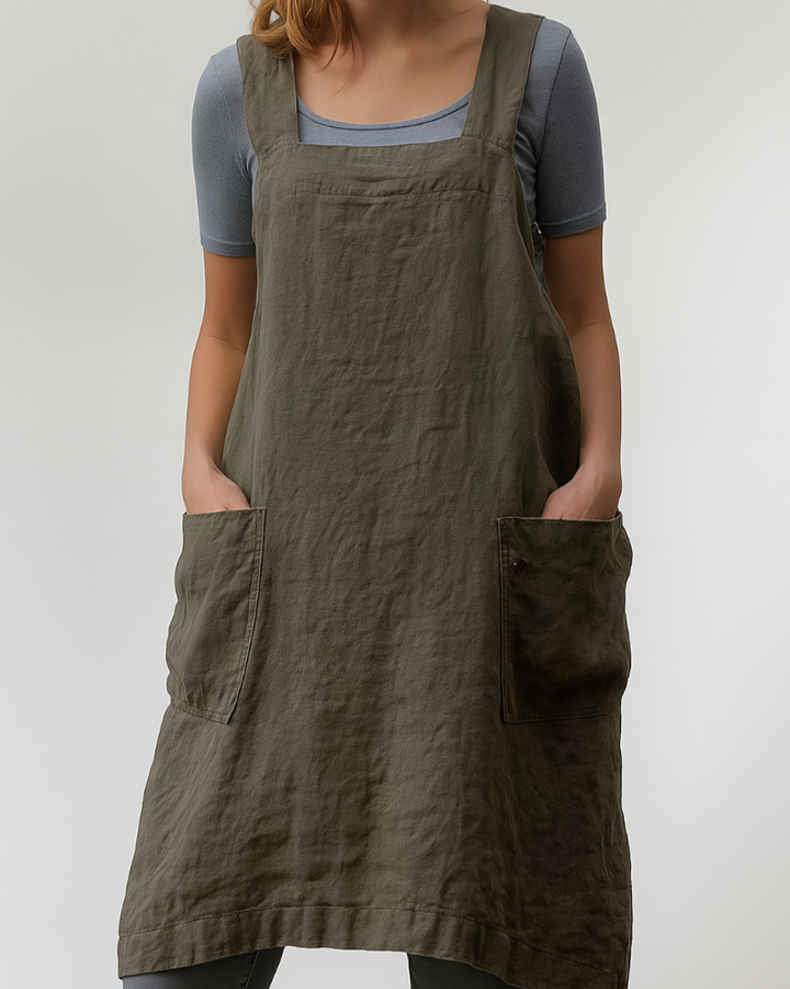 Versatile women's apron dress with a chic, modern design. Includes front pockets and adjustable cross-back for everyday wear.