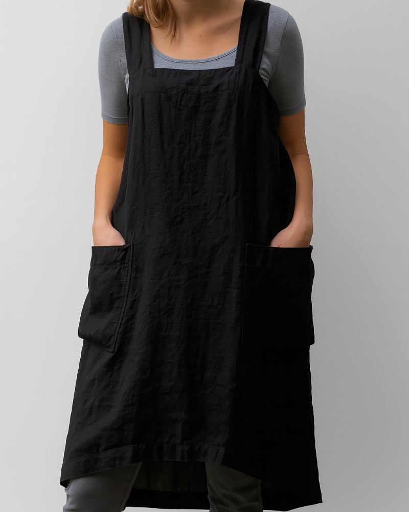 Everyday women's apron dress featuring large pockets and an adjustable fit. Ideal for casual spring and summer fashion.