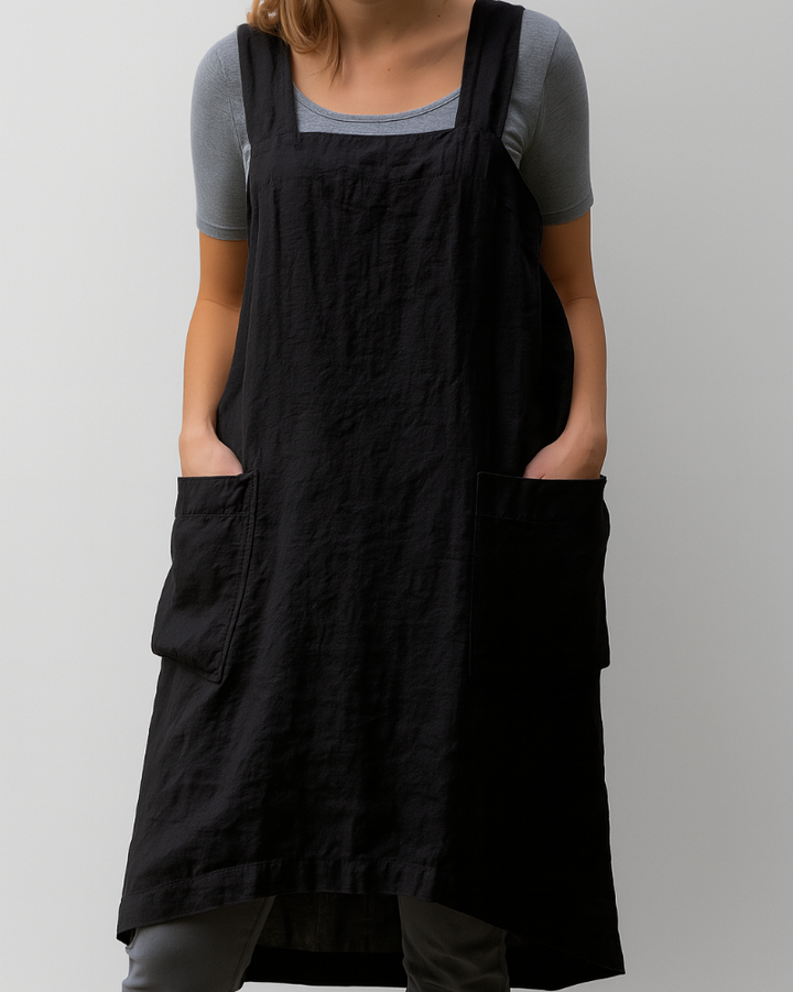 Everyday women's apron dress featuring large pockets and an adjustable fit. Ideal for casual spring and summer fashion.