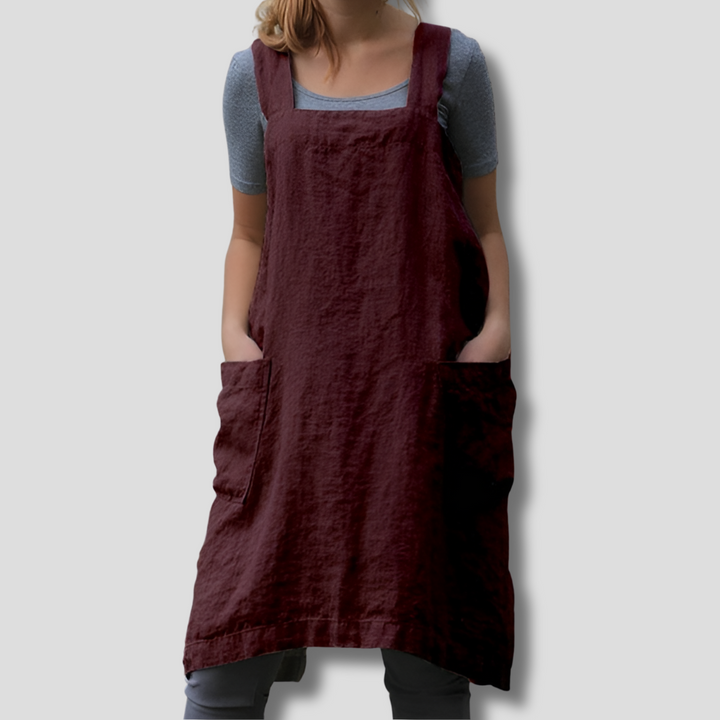 Relaxed fit women's apron dress, chic and comfortable, with adjustable straps and handy pockets for versatile styling.