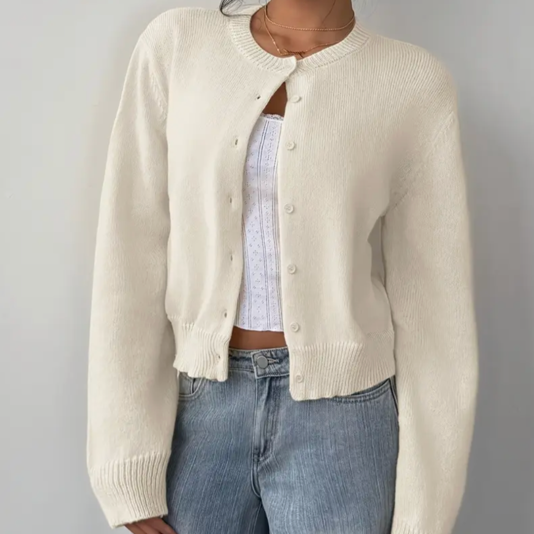 Women's stylish cropped cardigan with ribbed trim. Perfect for elegant layering.