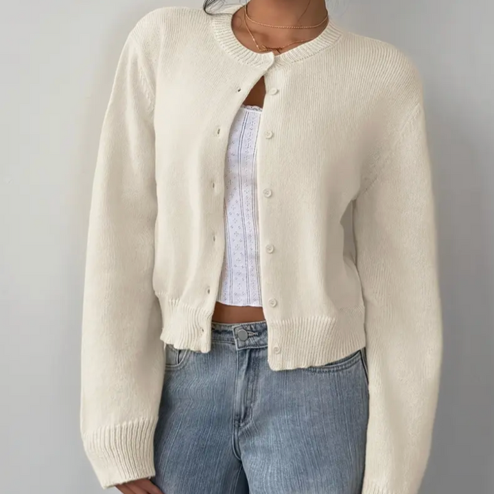 Women's stylish cropped cardigan with ribbed trim. Perfect for elegant layering.
