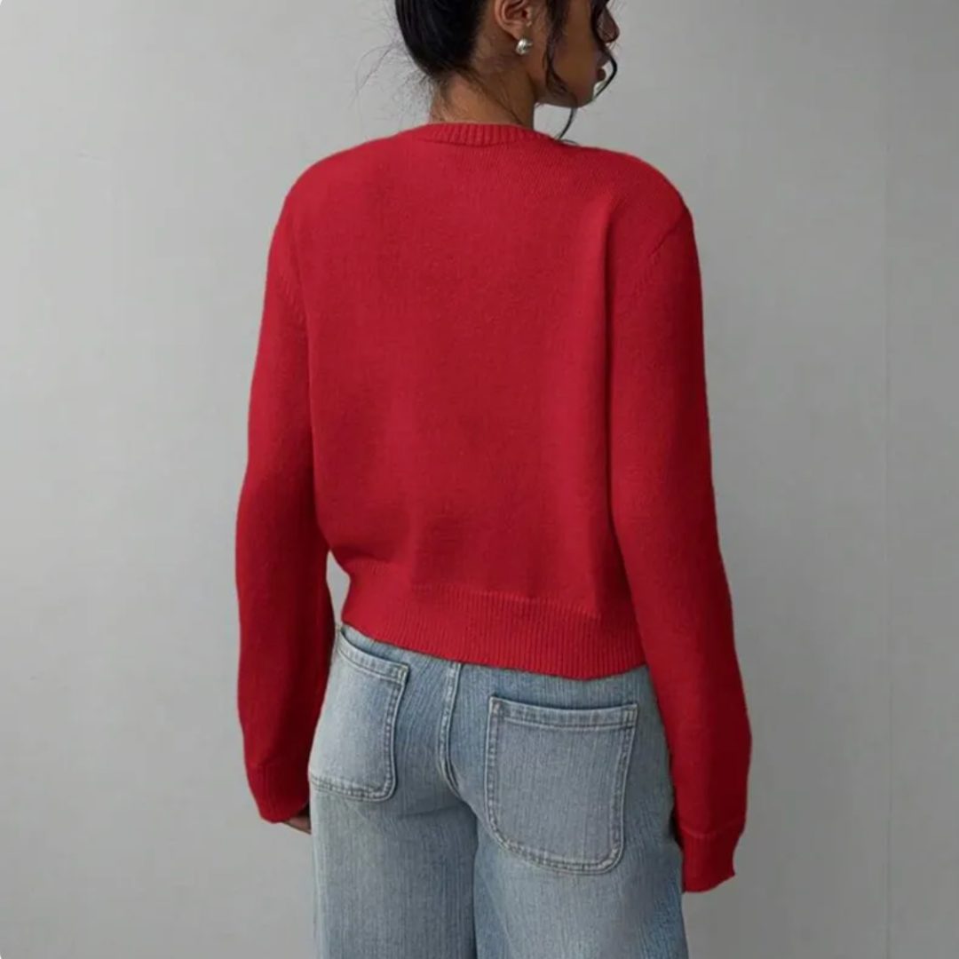 Feminine cropped cardigan for women. Ribbed accents enhance its stylish appeal.