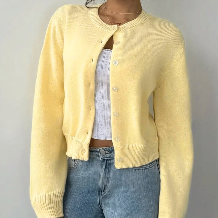 Short, button-front women's cardigan. Elegant ribbed trim adds a refined touch.