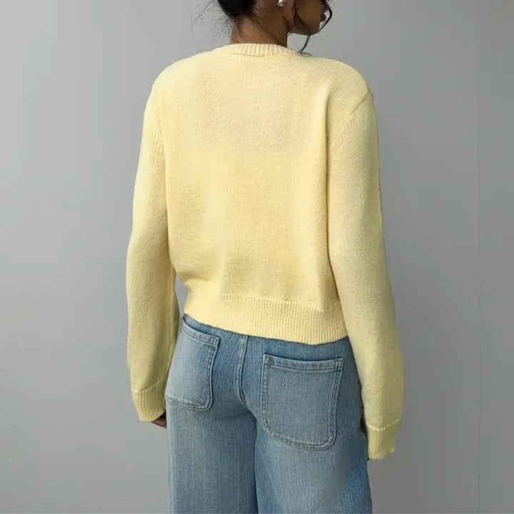 Comfortable women's cropped cardigan with a stylish ribbed trim. Perfect for layering.