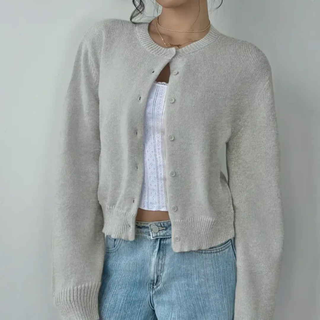 Elegant cropped women's sweater. Button-up design with chic ribbed details.