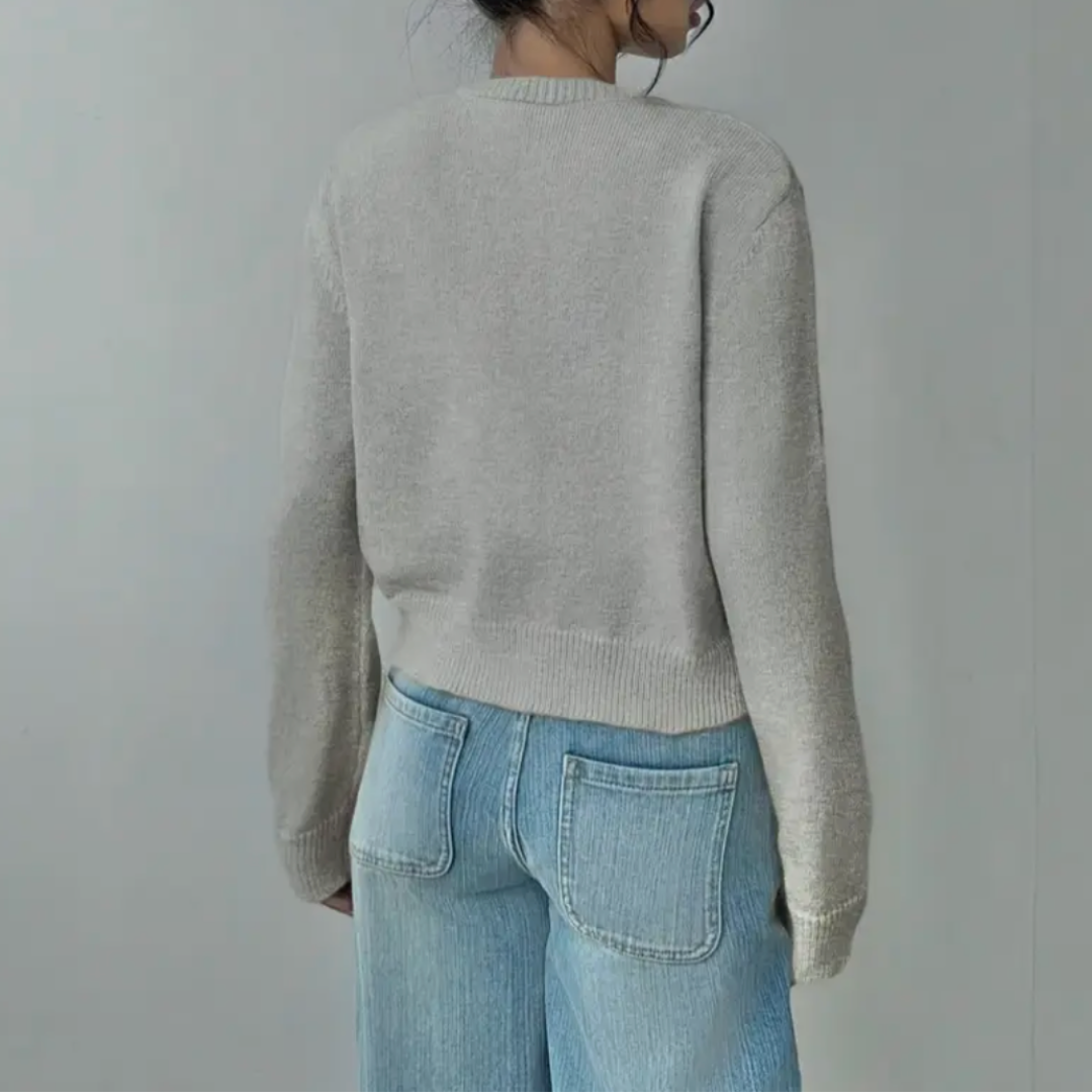 Versatile women's cropped top. Soft knit cardigan with elegant ribbed accents.