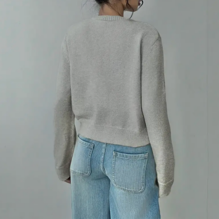 Versatile women's cropped top. Soft knit cardigan with elegant ribbed accents.