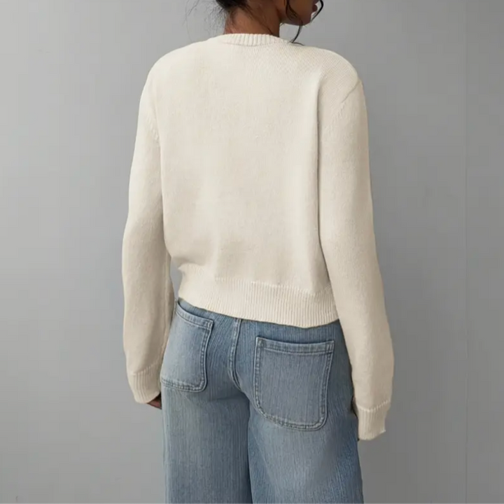 Fashionable women's cropped sweater with button-front closure & ribbed details.