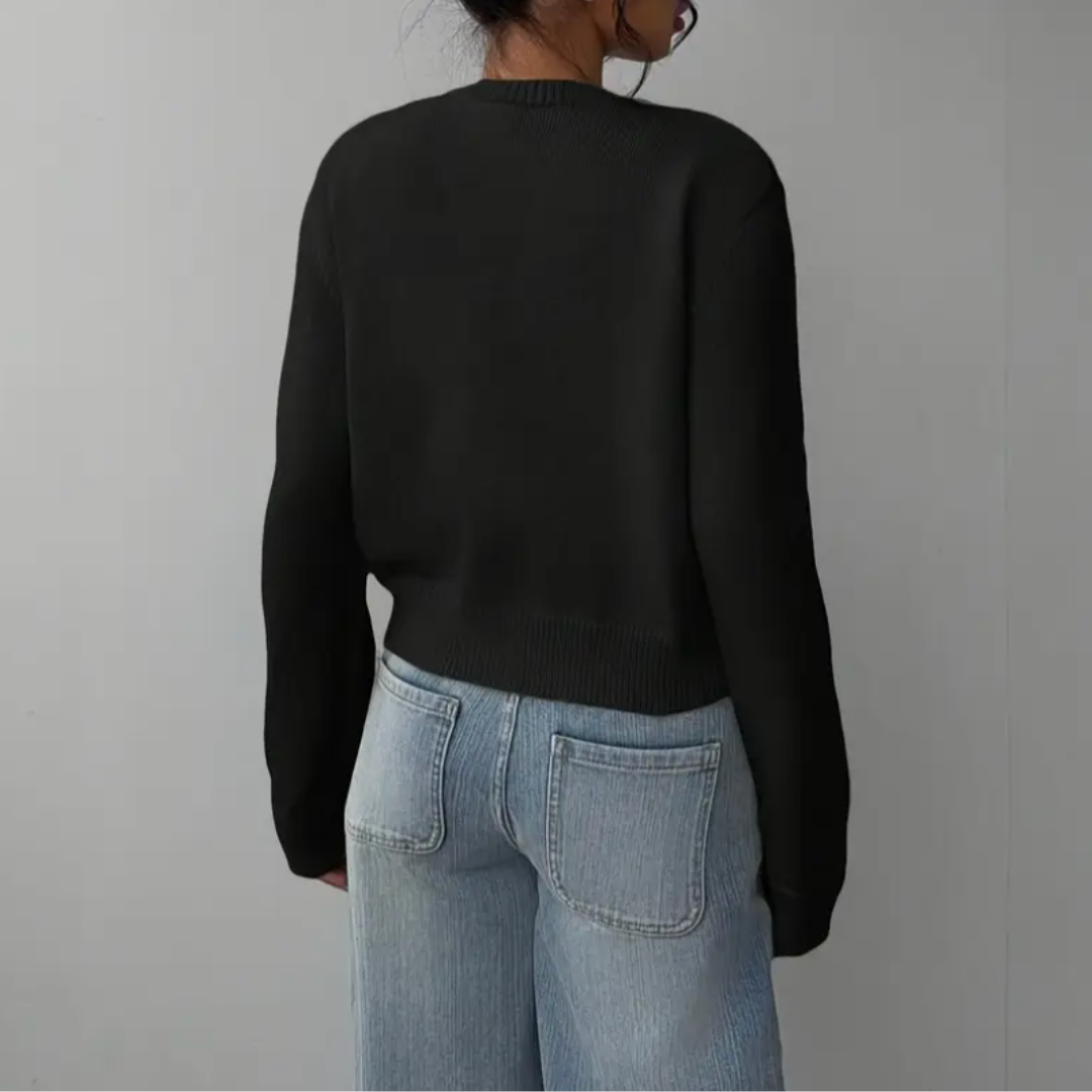 Versatile women's short cardigan. Ribbed trim and elegant design for any outfit.