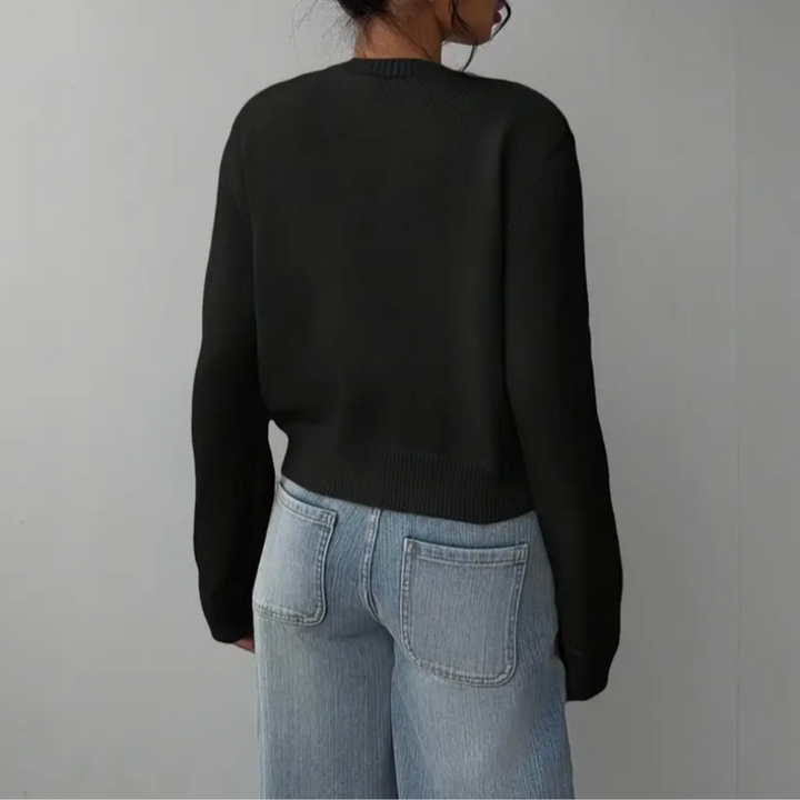 Versatile women's short cardigan. Ribbed trim and elegant design for any outfit.