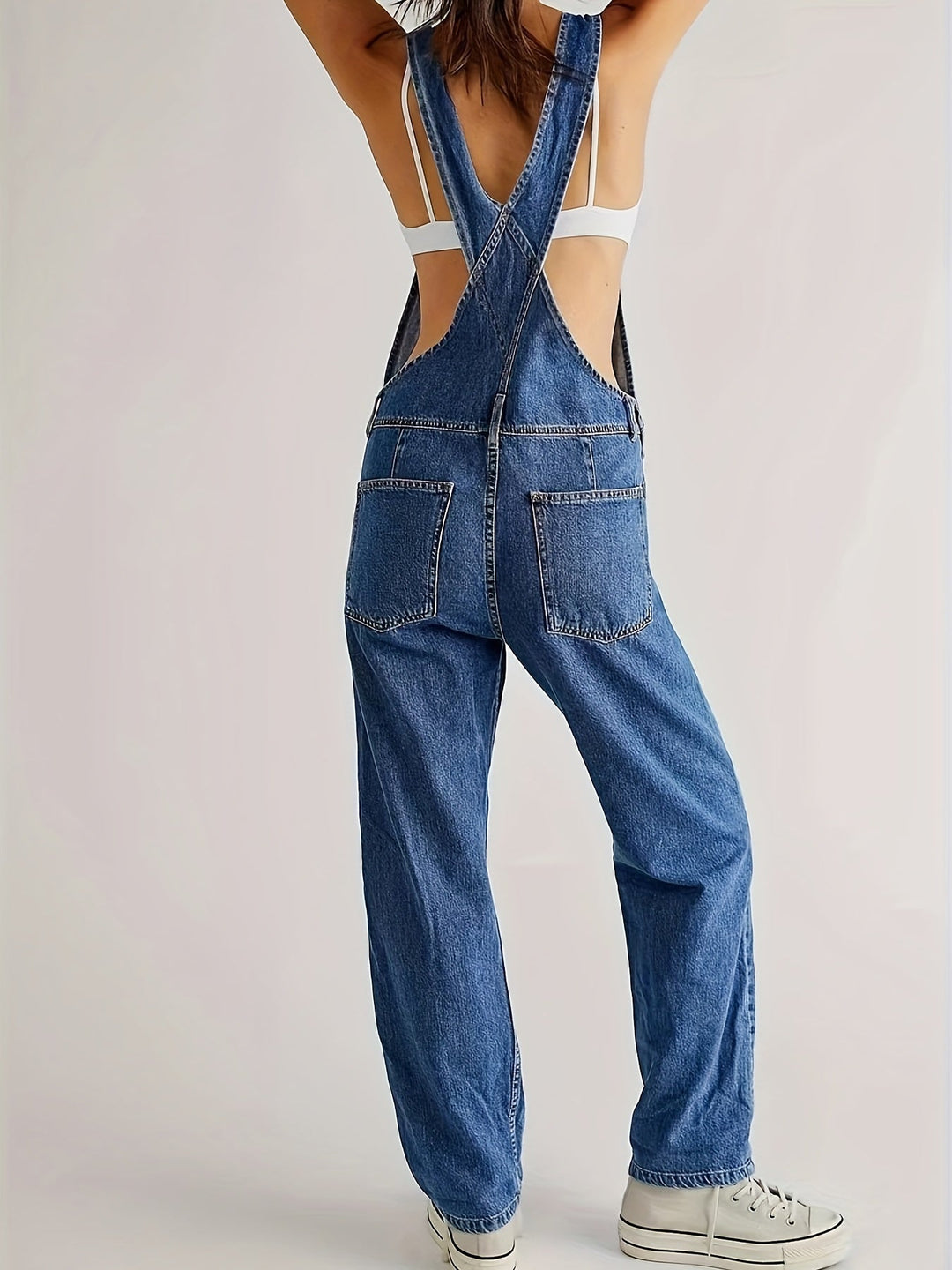 Fashionable women's denim jumpsuit, a versatile piece for any season's casual look. Everyday comfy.