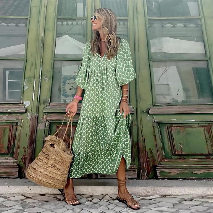 Modern geometric print high-low dress for women, offering a chic, flowy silhouette. Versatile fashion.