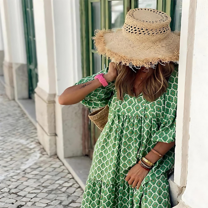 Elegant women's high-low dress with vibrant geometric print, ideal for casual or party wear. Comfortable fit.