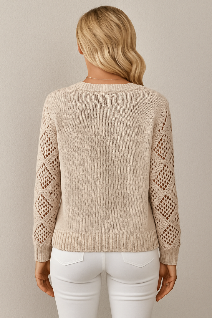Transitional women's knit sweater with intricate crochet sleeves. Ideal for stylish layering.