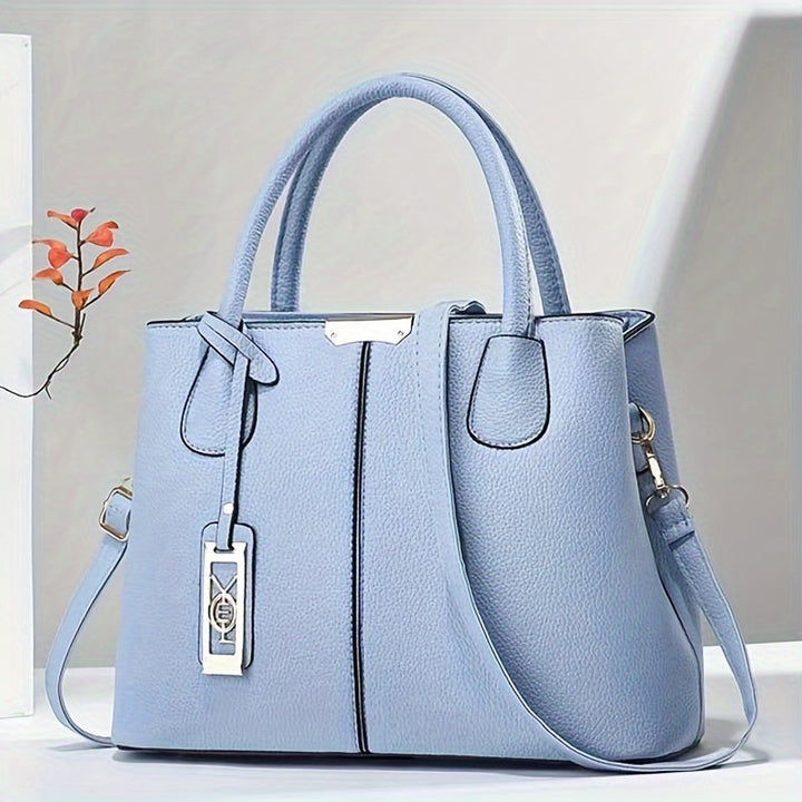 Elegant women's leather crossbody bag, versatile for day or evening, featuring a sleek design.