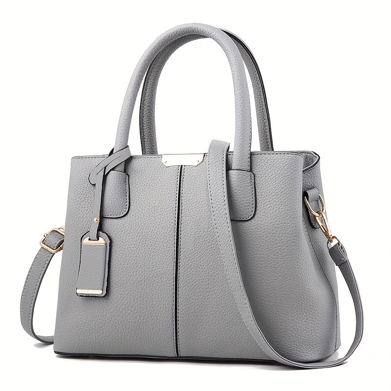 Stylish women's black leather handbag, convertible to tote or crossbody, a chic fashion accessory.
