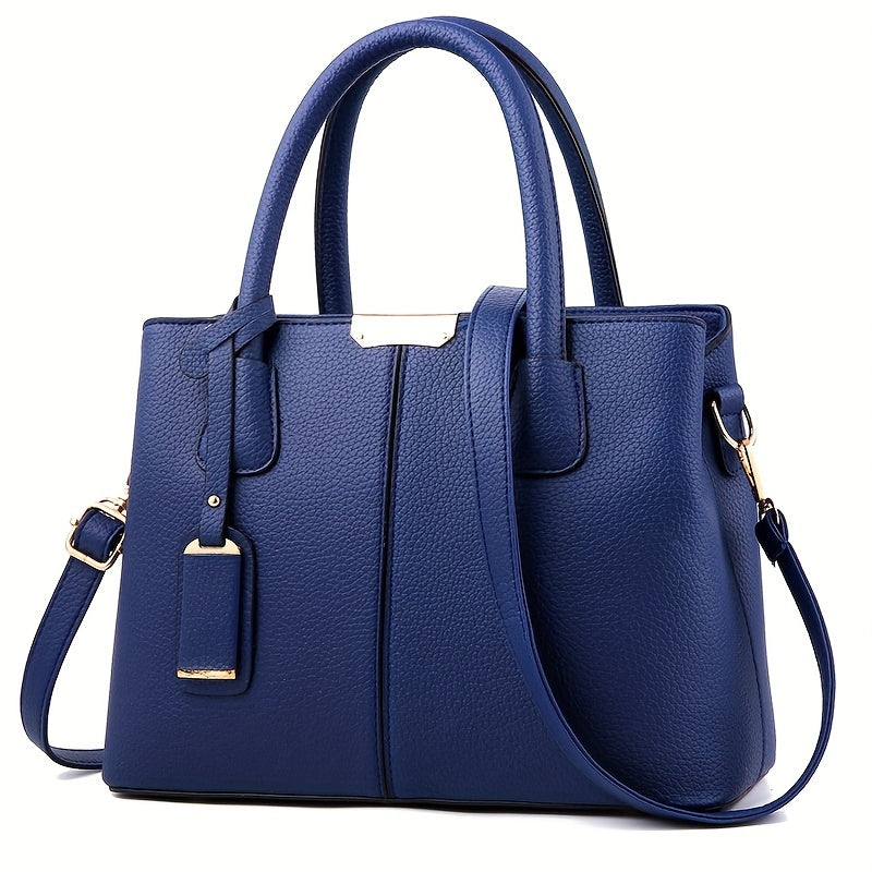 Chic women's leather handbag with a sturdy top handle & detachable crossbody strap for flexible wear.