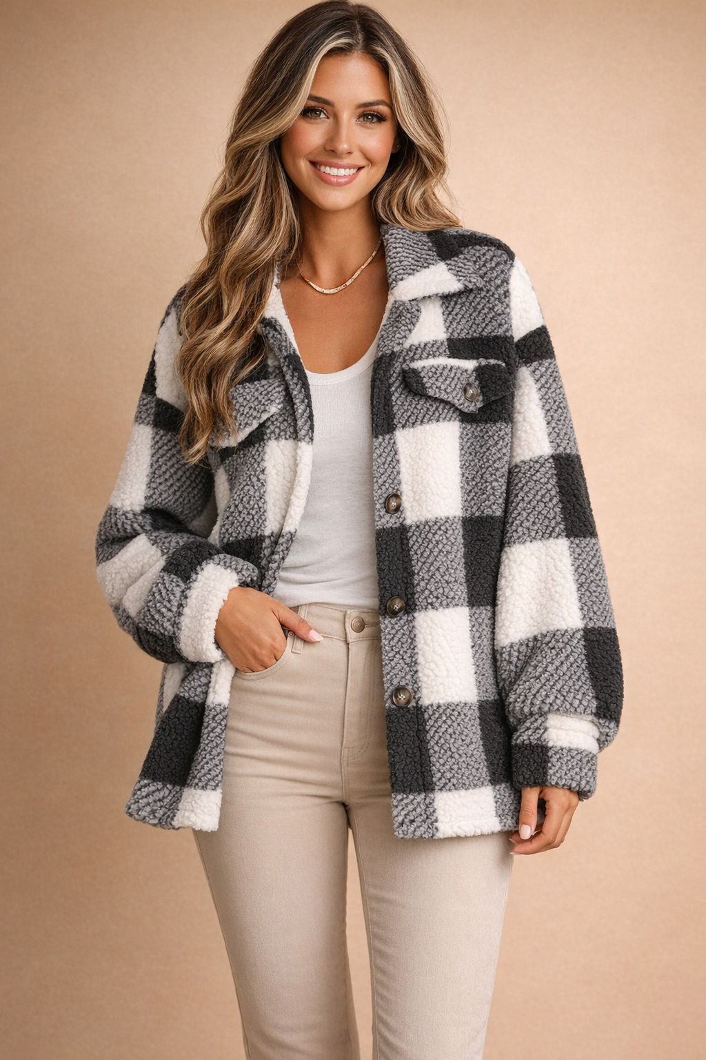 Trendy grid pattern women's shacket with button-front closure. An oversized and stylish layering jacket.