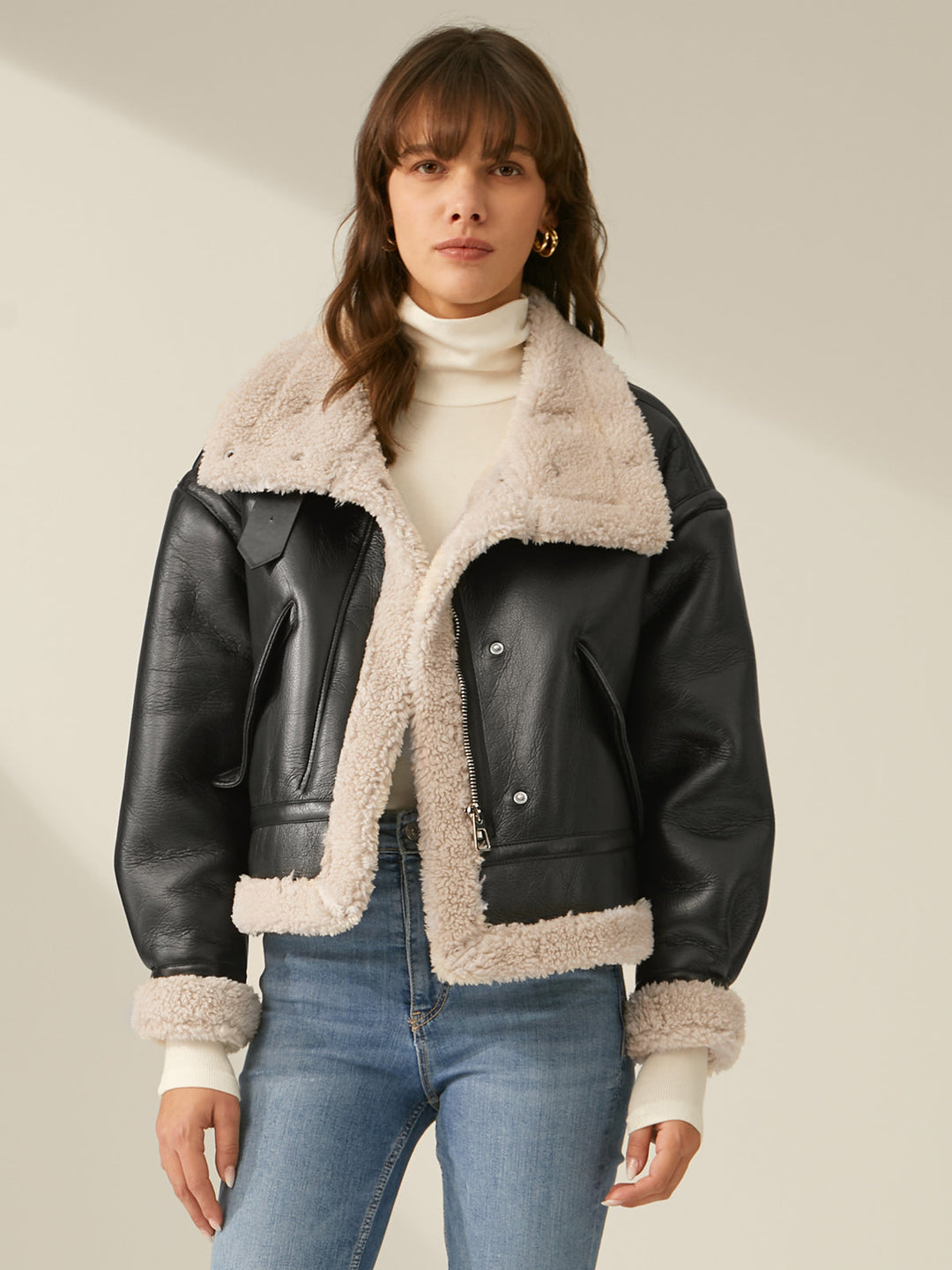 Close-up of warm, cozy fabric on a women's flight jacket, perfect for stylish winter outerwear.