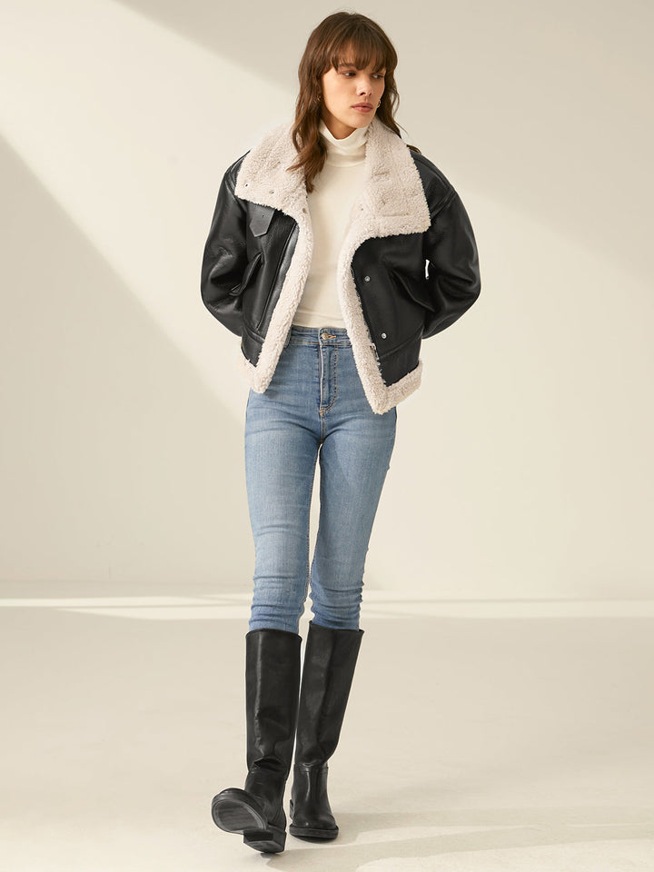 Woman enjoying outdoors in a stylish, warm flight jacket. Perfect cozy outerwear for casual winter adventures.