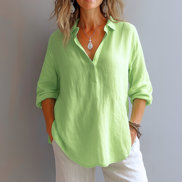 Comfortable green women's blouse, a stylish and versatile top for everyday wear or an elegant office outfit.