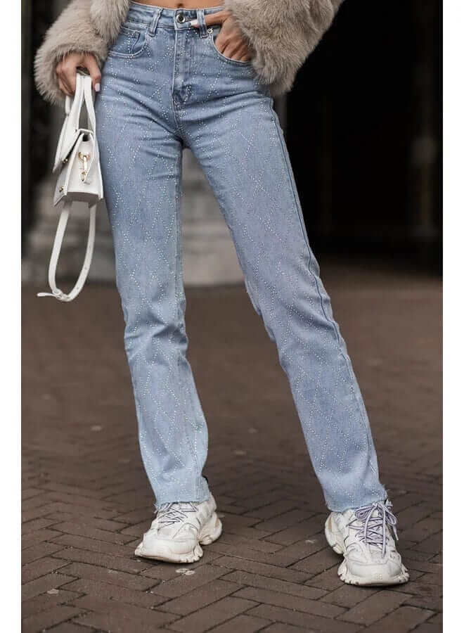 Stylish women's blue denim jeans, straight leg fit, adorned with a unique and intricate diamond pattern.