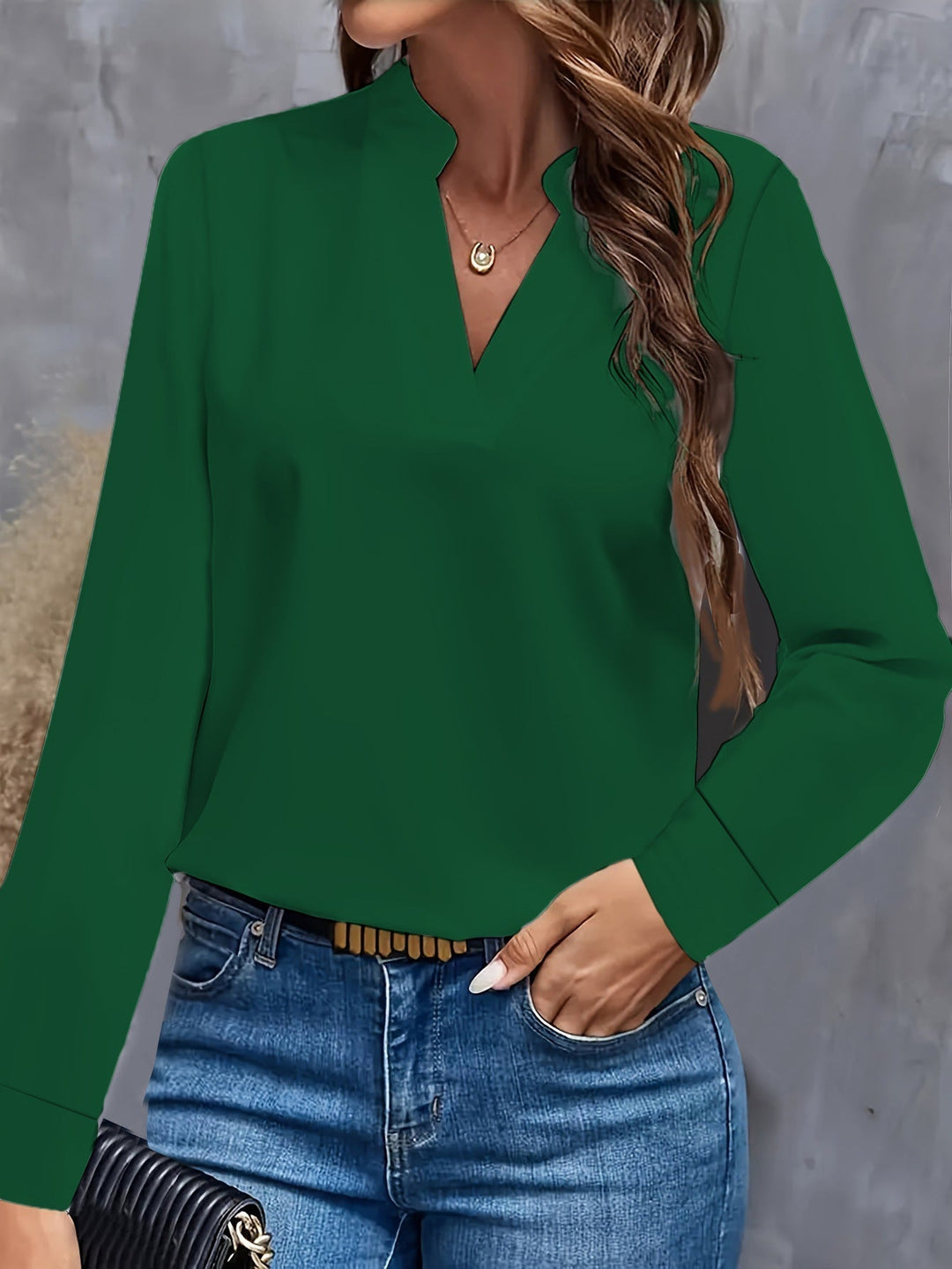Elegant women's V-neck blouse with a light, flowy fit. Versatile, comfortable top, ideal for summer fashion.
