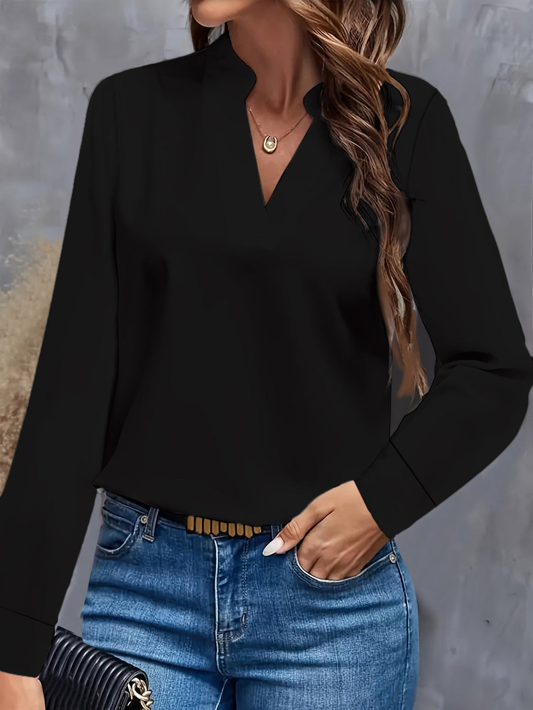 Stylish women's V-neck shirt, flowy and lightweight. A comfortable, elegant top suitable for various occasions.