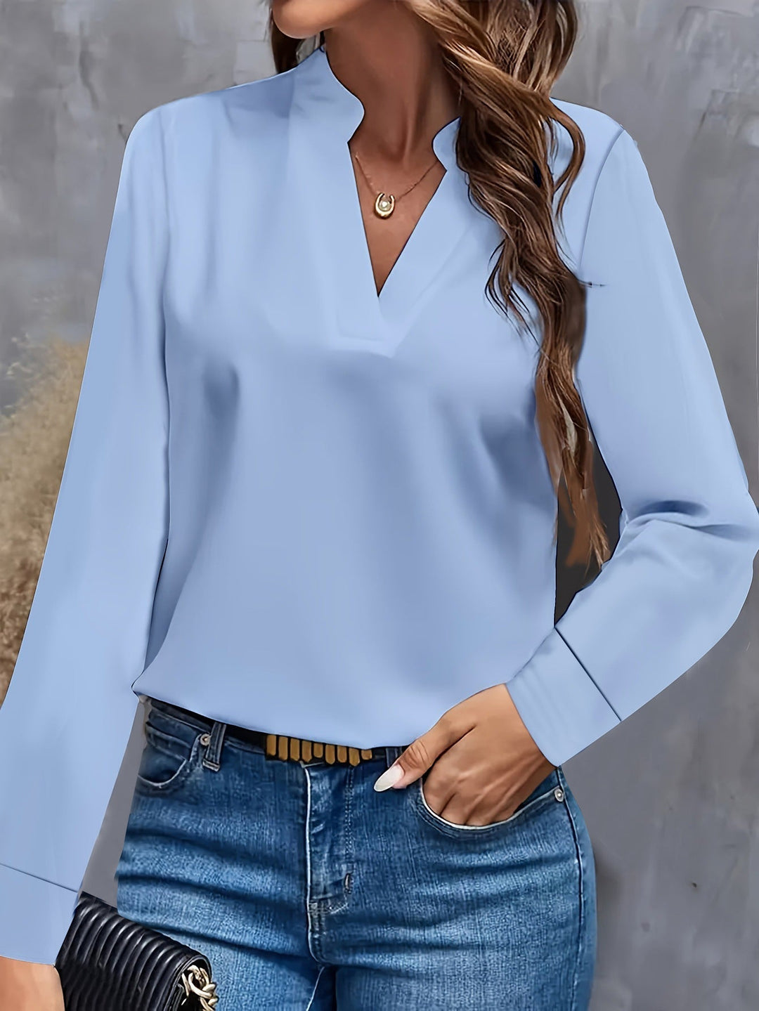Lightweight women's V-neck blouse, featuring a flowy fit. This chic & comfortable top is perfect for summer fashion.