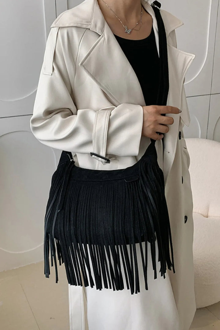 Accessorize with this women's suede fringe crossbody, a must-have boho chic shoulder bag.