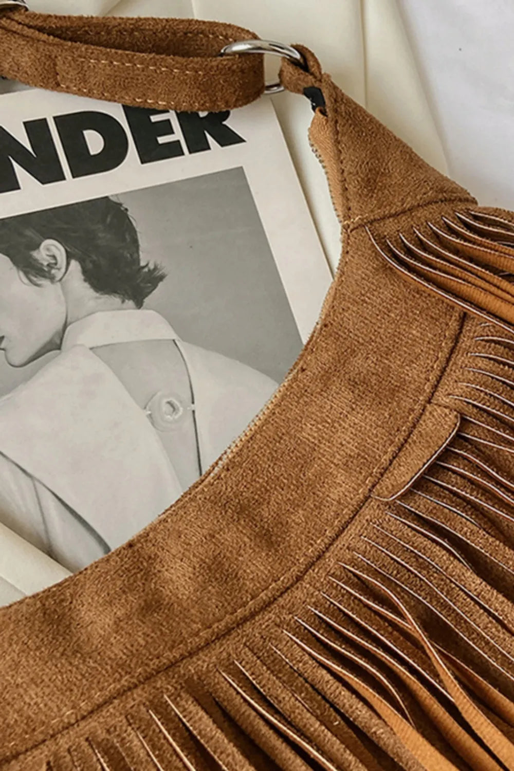Festival-ready women's suede fringe shoulder bag, a stylish boho accessory.