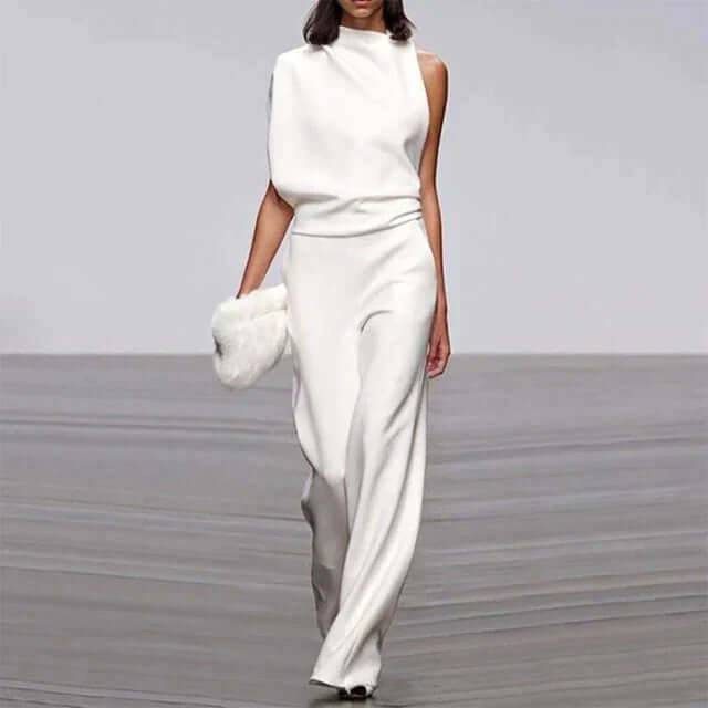 Model wearing a stylish wide-leg glam jumpsuit, ideal for summer parties, showcasing a chic & versatile look.