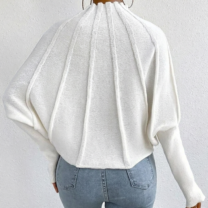 Unique sunburst design women's jumper, a versatile mock neck top with fashionable batwing sleeves.