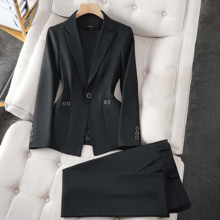 Women's tailored blazer and trouser set, ideal for professional office wear. Elegant business suit for a chic work look.