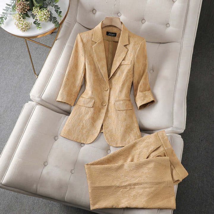 Women's tailored blazer and trousers set, perfect for professional office wear and business meetings.