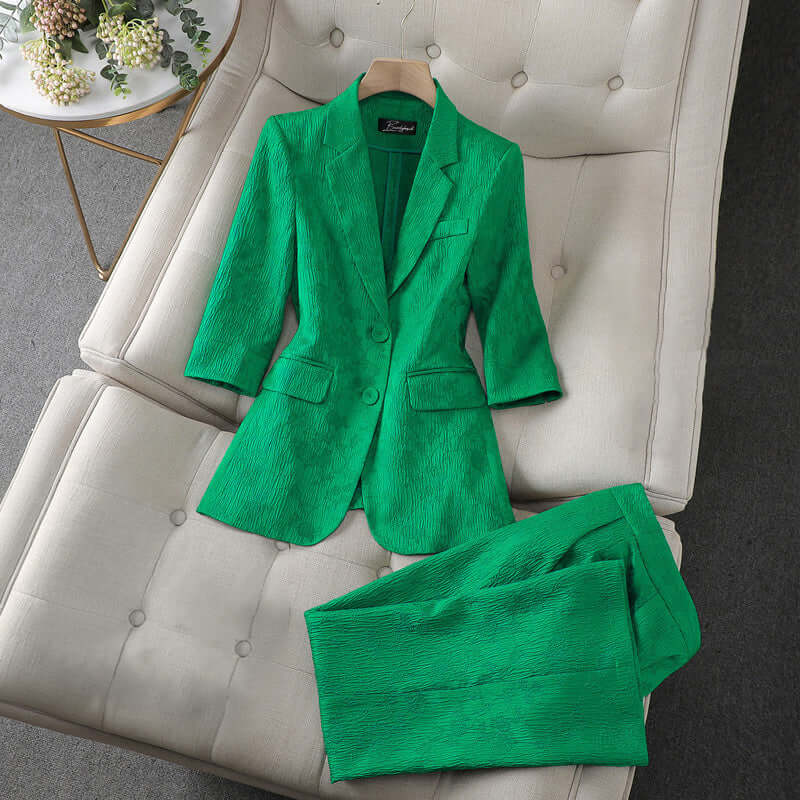 Elegant women's tailored suit set with a blazer and trousers, ideal for formal outfits & sophisticated style.