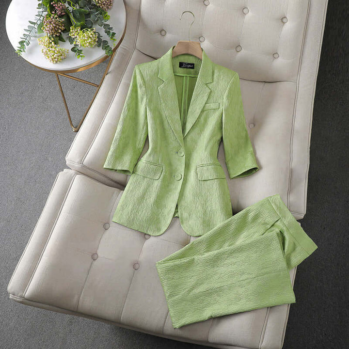 Chic women's matching two-piece set, a tailored blazer & trousers for versatile business casual fashion.