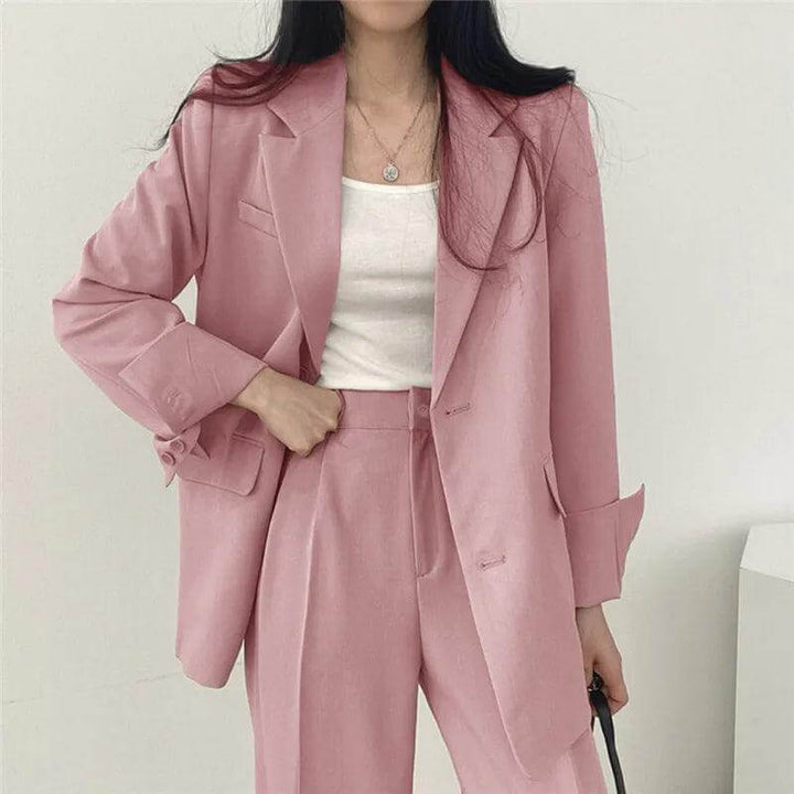 Women's tailored blazer & straight-leg pants set for professional business wear.