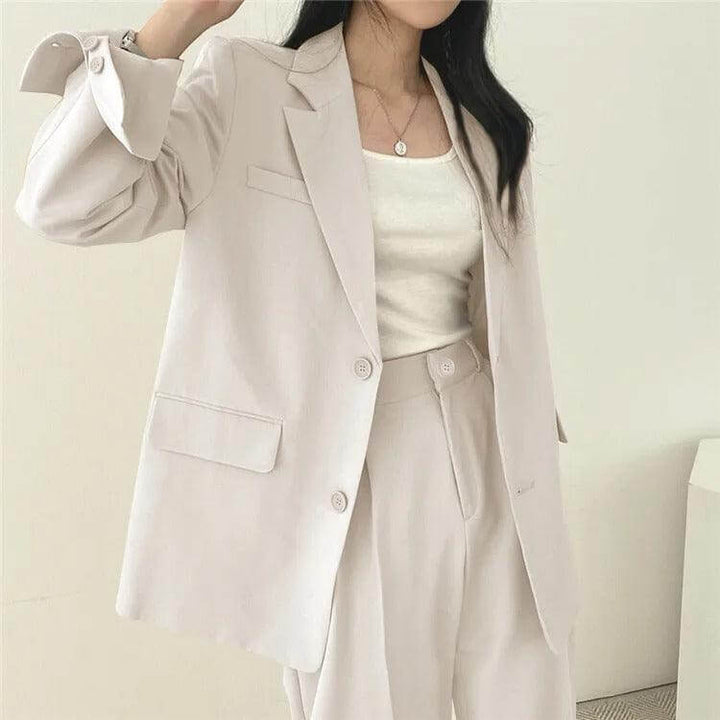 Office-ready women's two-piece set: tailored blazer and chic straight-leg pants.