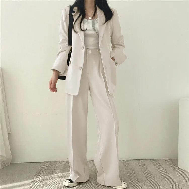 Formal women's professional suit: tailored blazer and straight-leg pants for elegance.